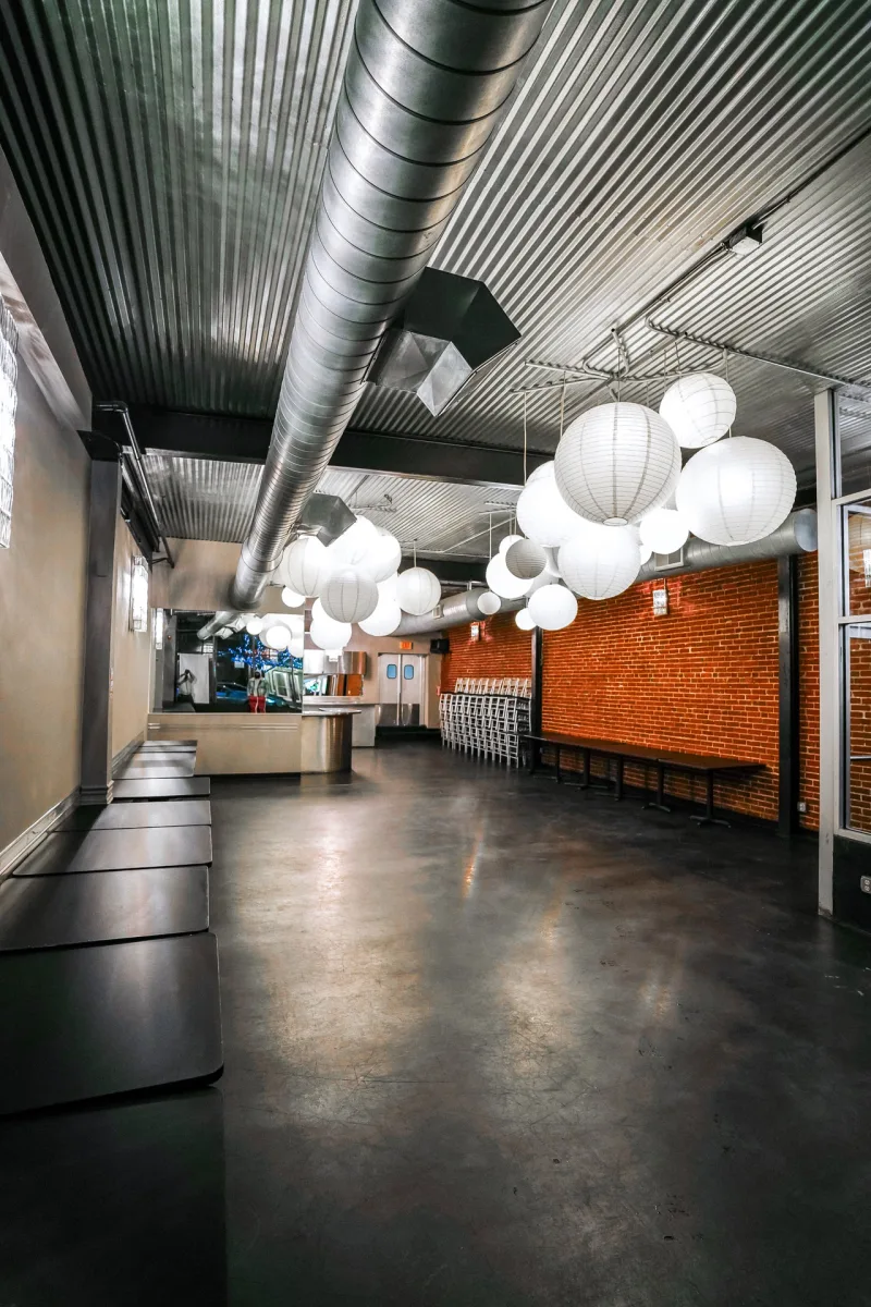 Inside The Original — paper lanterns and exposed brick