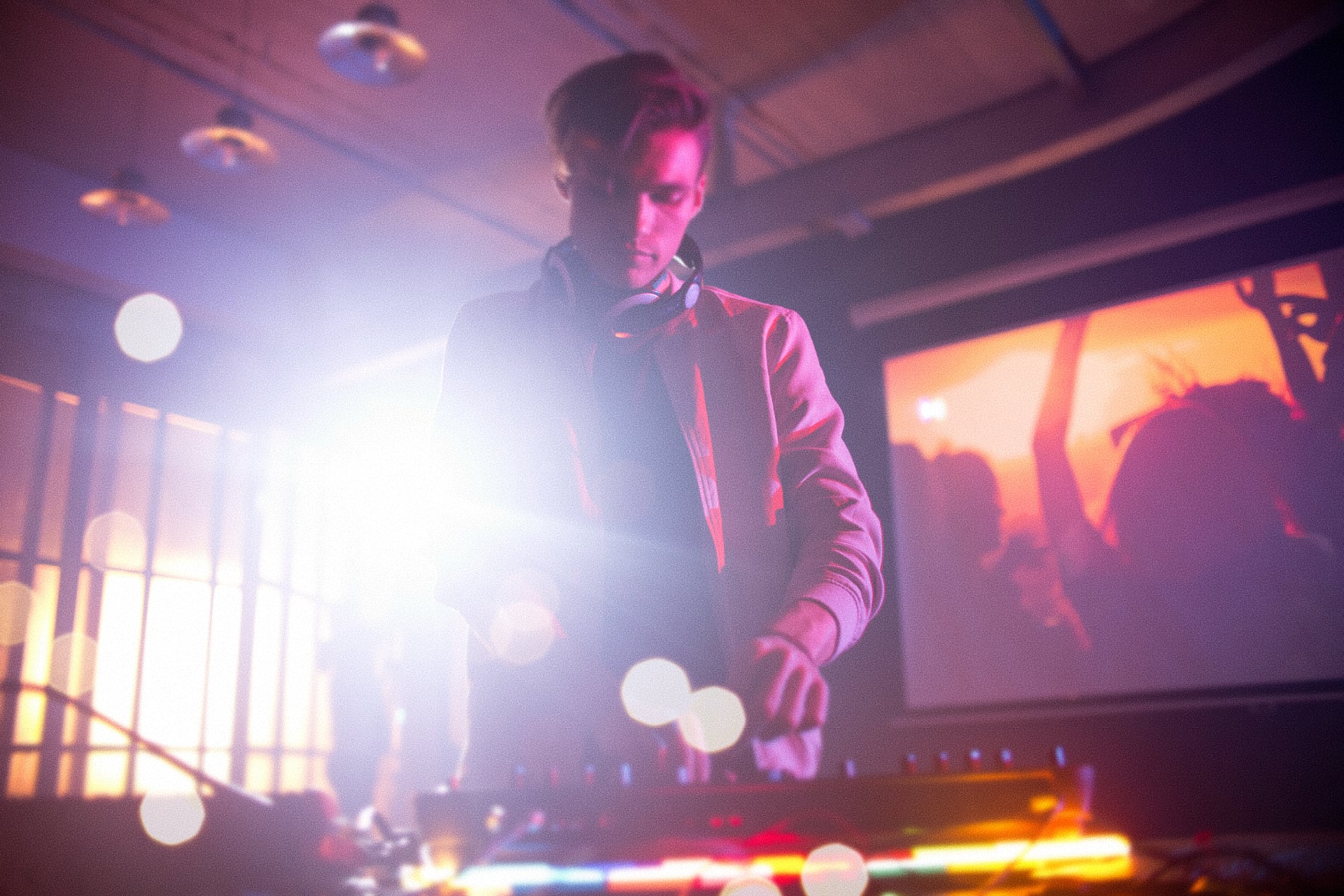EDM festival or club scene with vivid stage lighting — example aesthetic for an electronic music video promotion campaign