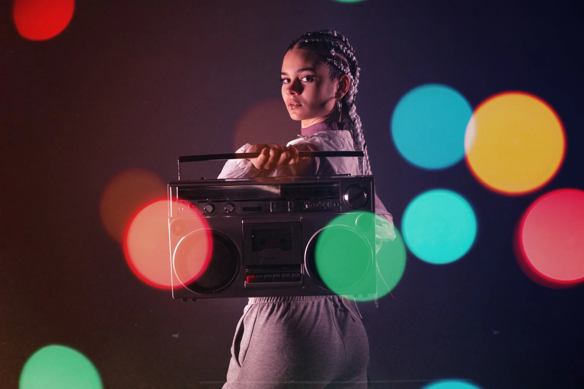 Hip hop music video production scene featuring artists in motion-blurred performance